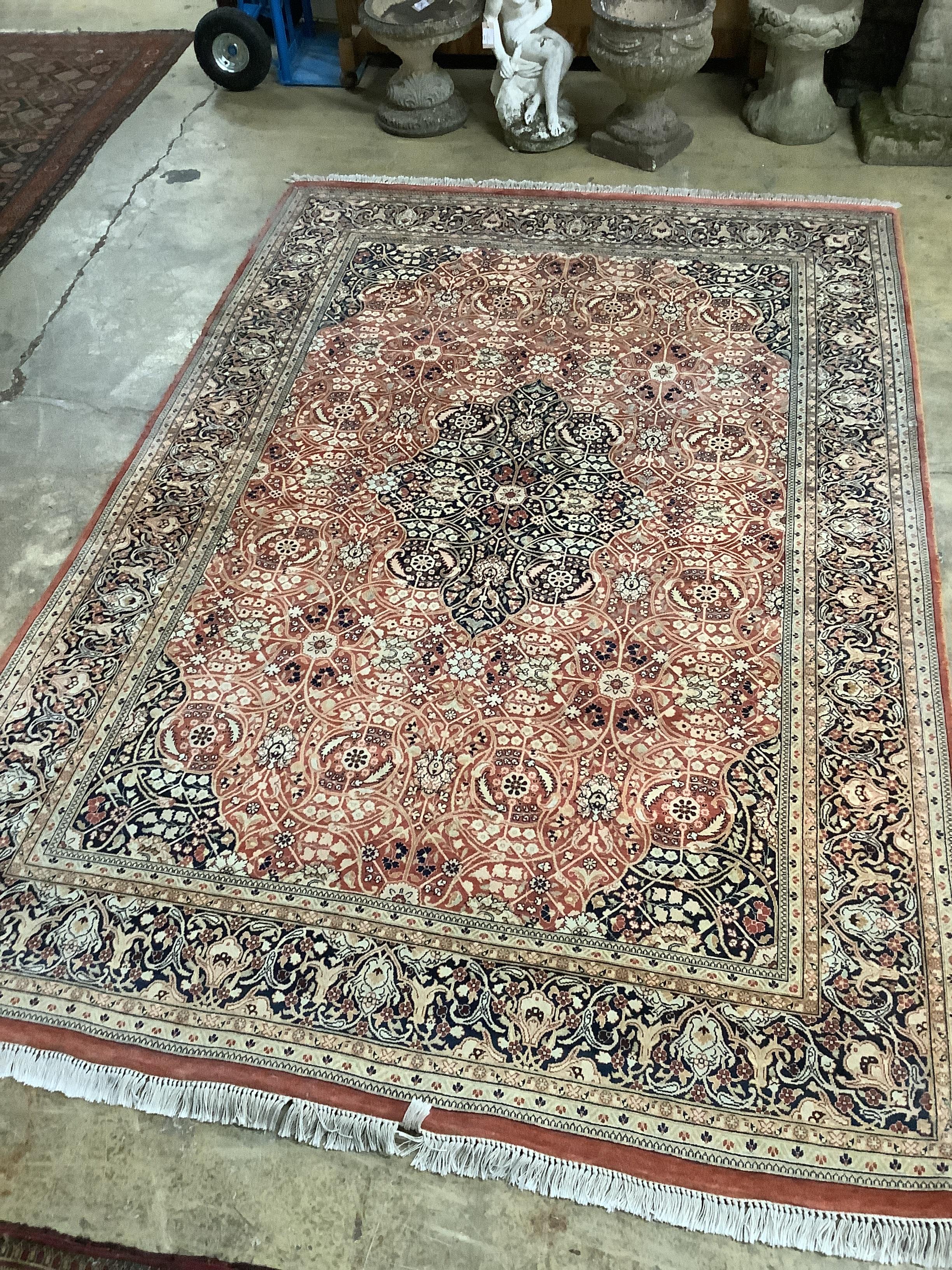 A North West Persian brick red ground carpet, 264 x 180cm